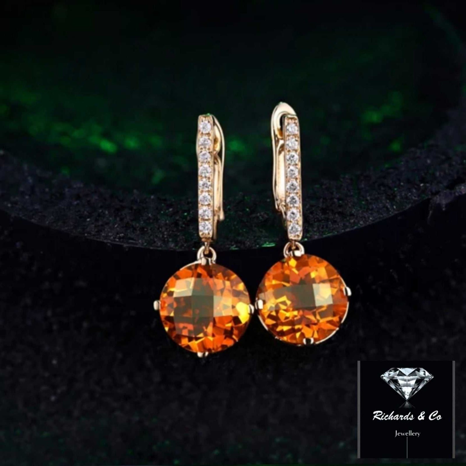 Citrine and diamond drop earrings set in 14k yellow gold with round cut citrine and natural diamonds