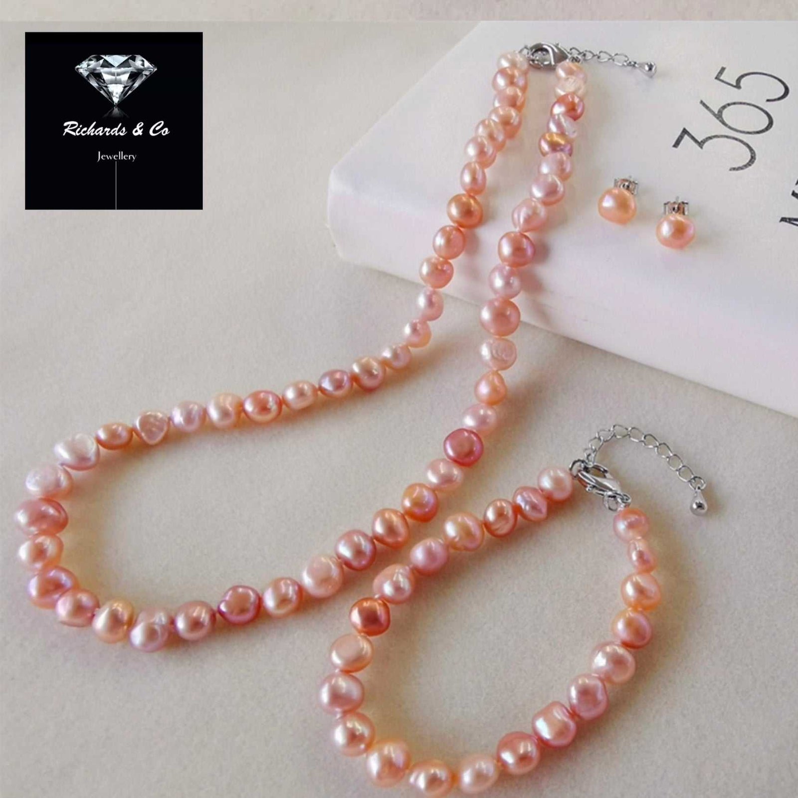Elegant pearl matching set with rose overtone freshwater pearls, necklace, bracelet, and earrings in sterling silver