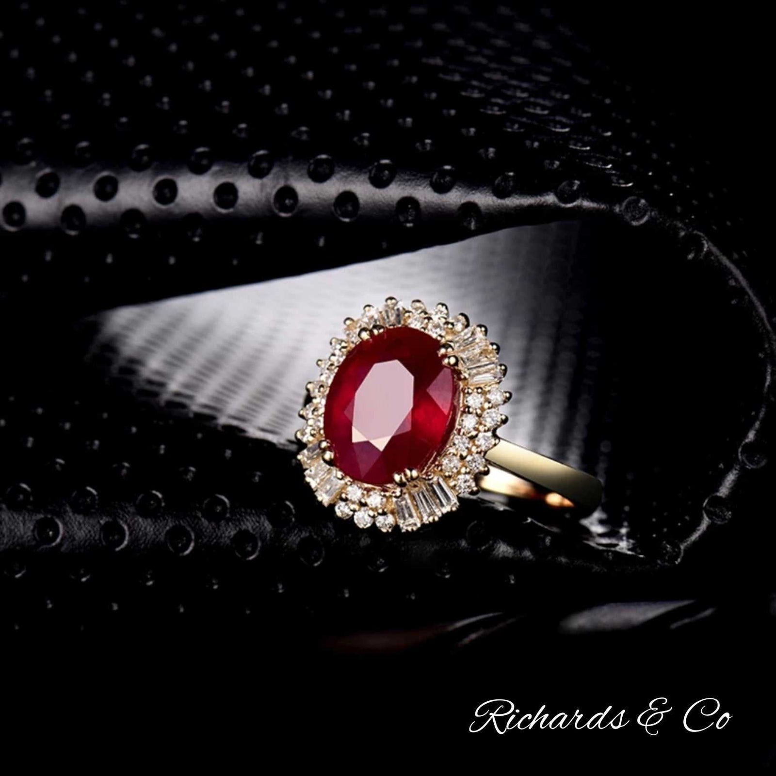 CACILLIA Ruby and diamond ring in 14k yellow gold with oval ruby and round baguette diamonds