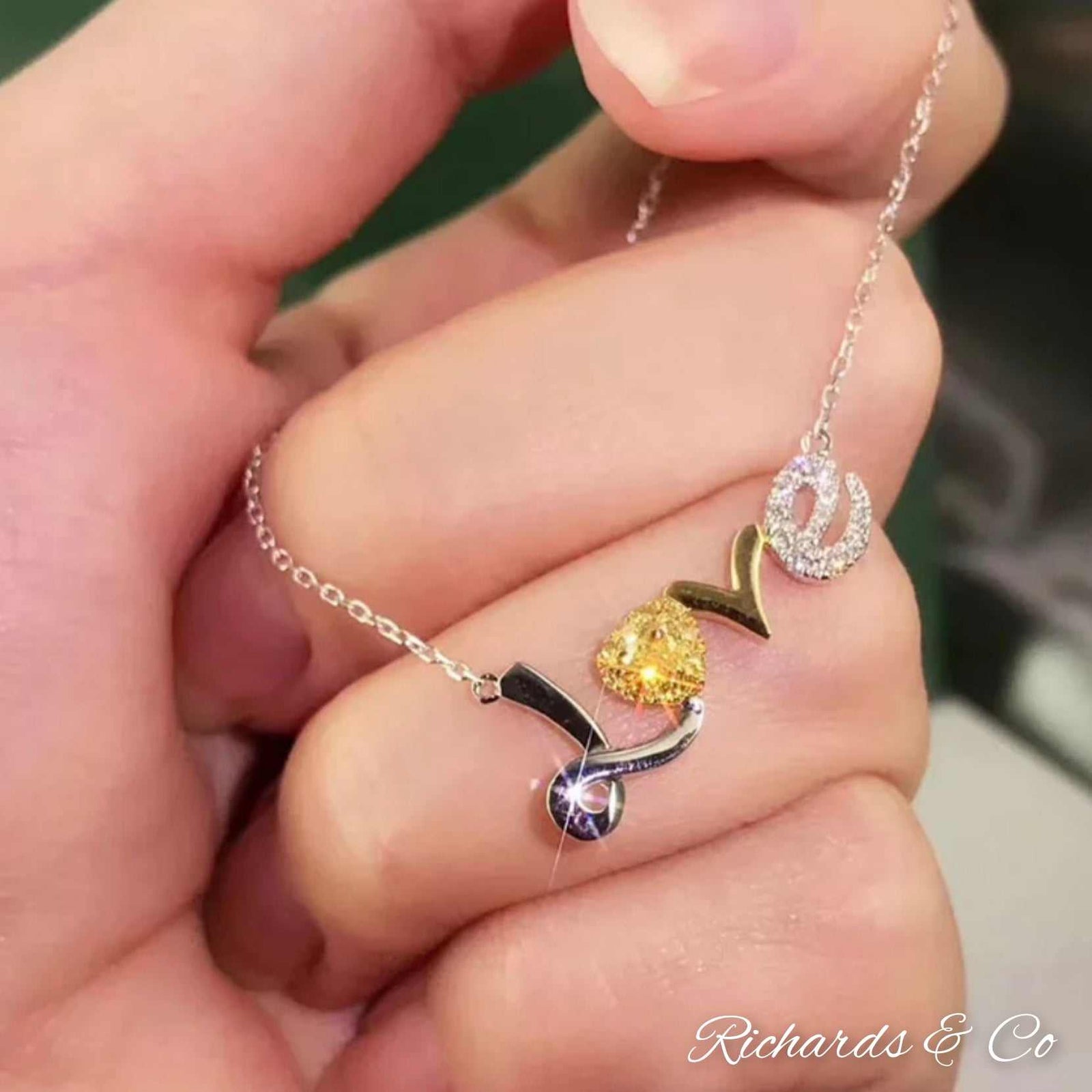 Diamond Love Necklace with 18K white gold, heart-shaped yellow diamond, and white diamonds in elegant design