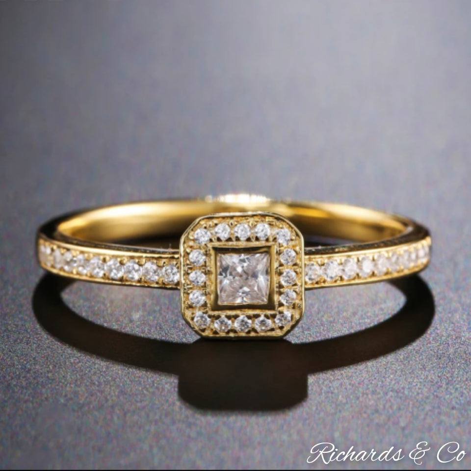 Princess cut diamond ring in 14K yellow gold with prong setting and side diamonds