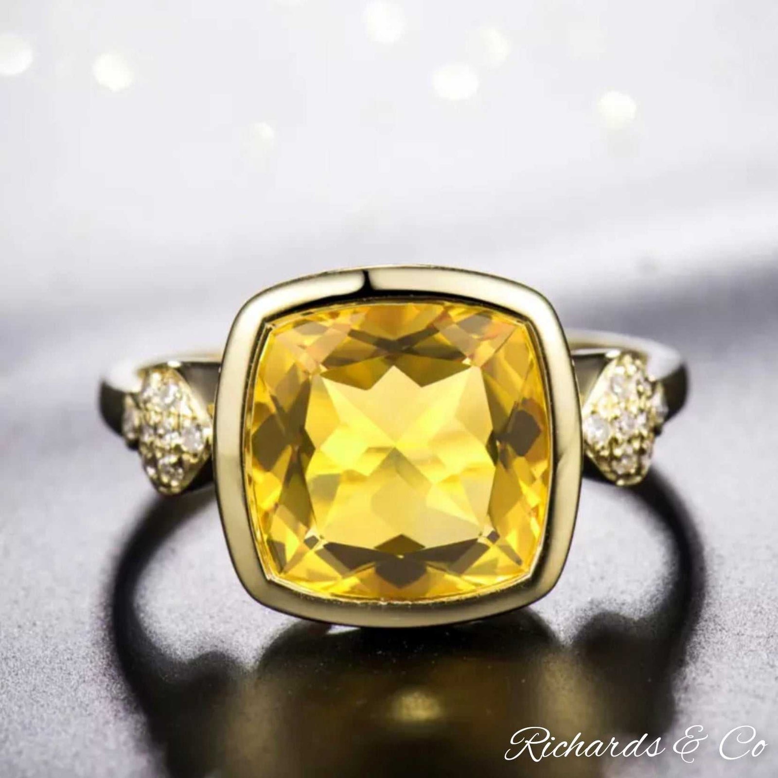 Citrine and diamond ring in 18K yellow gold with cushion cut citrine and round diamonds