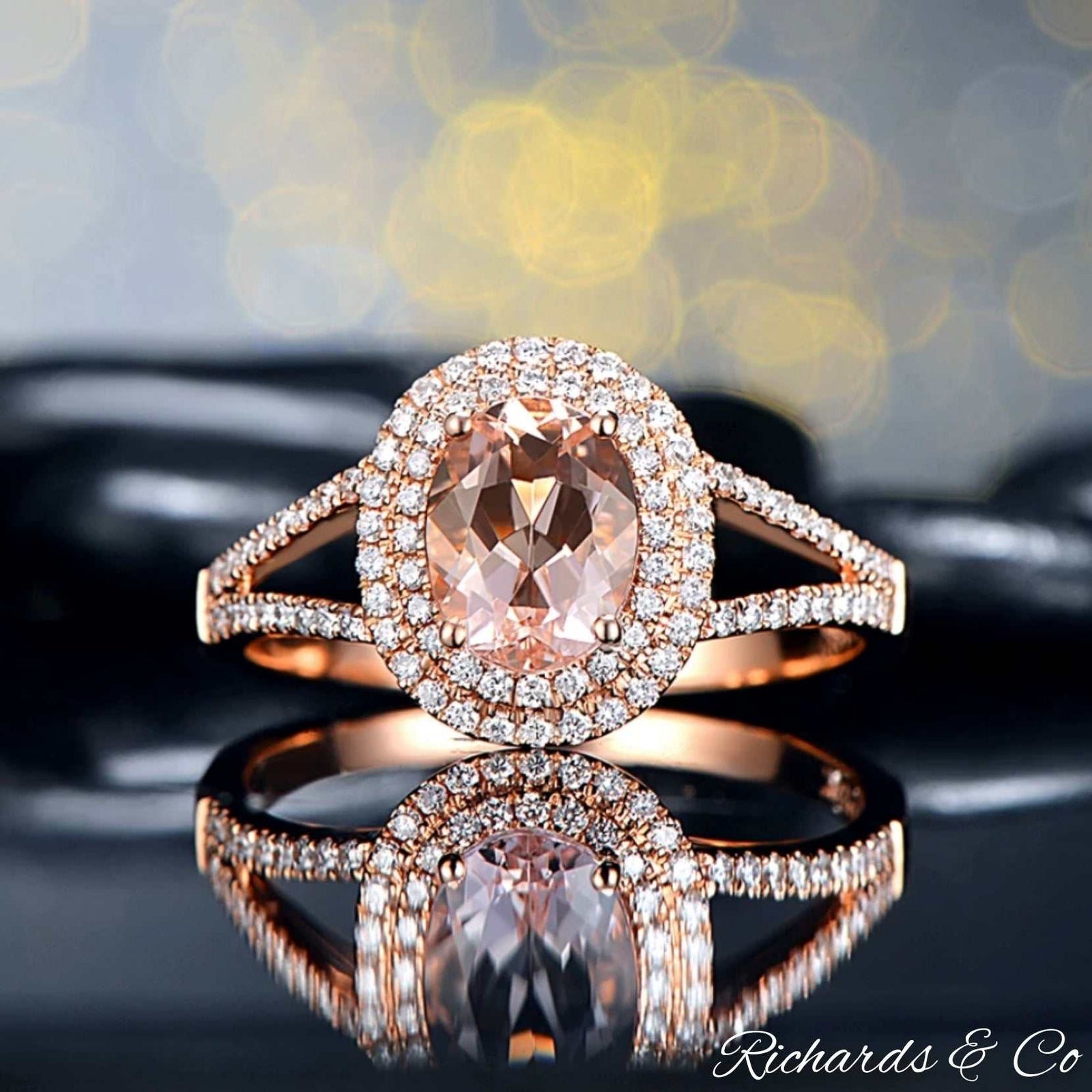 14K rose gold ring with oval morganite center stone surrounded by pave-set diamonds, elegant and luxurious design
