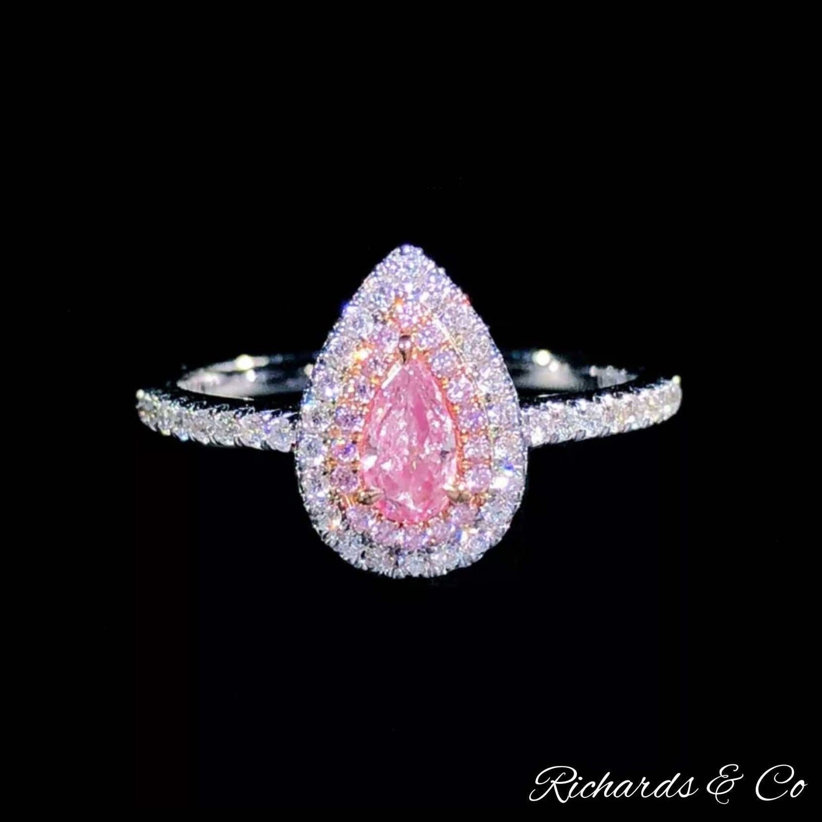 Rare pink diamond pear cut ring in 18K white gold with natural white diamond halo and band