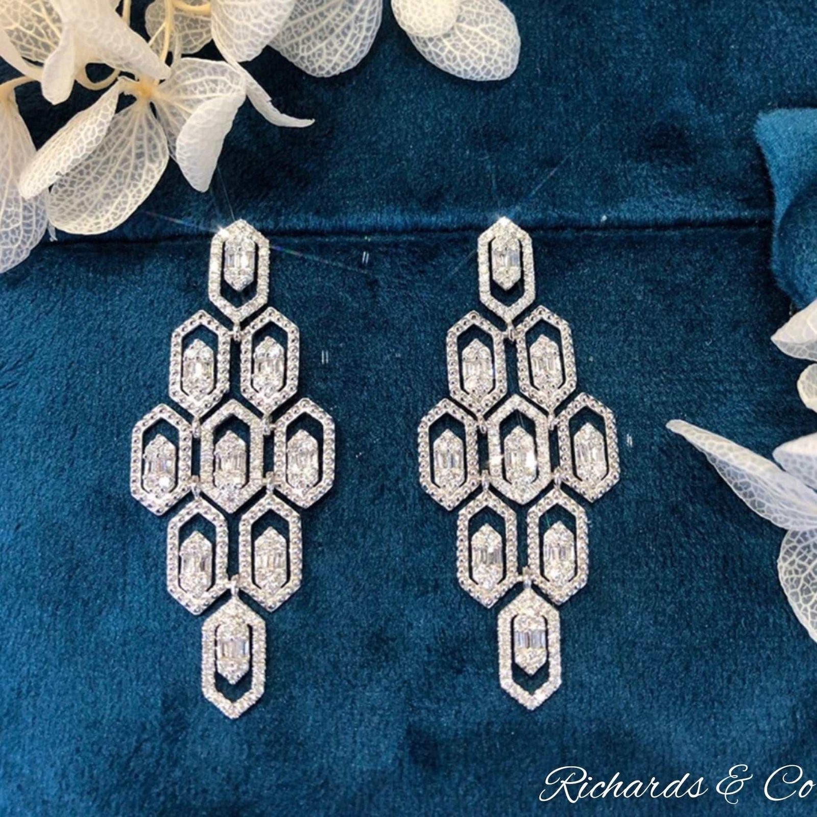 ALICE Diamond long drop earrings handcrafted in 18K white gold with 1.20ct diamonds on dark blue velvet background