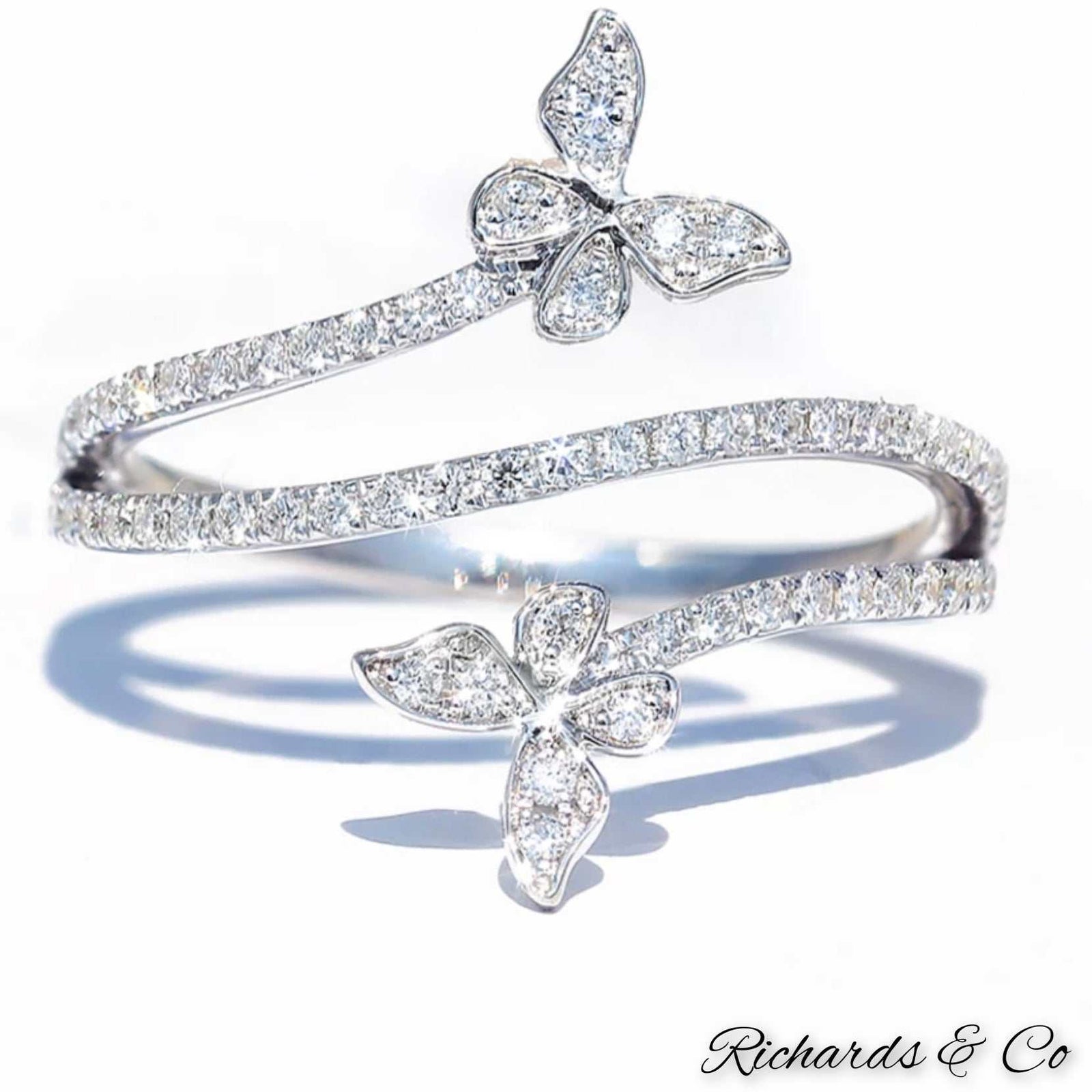 Butterfly natural diamond ring in 18K white gold with round diamonds and prong setting