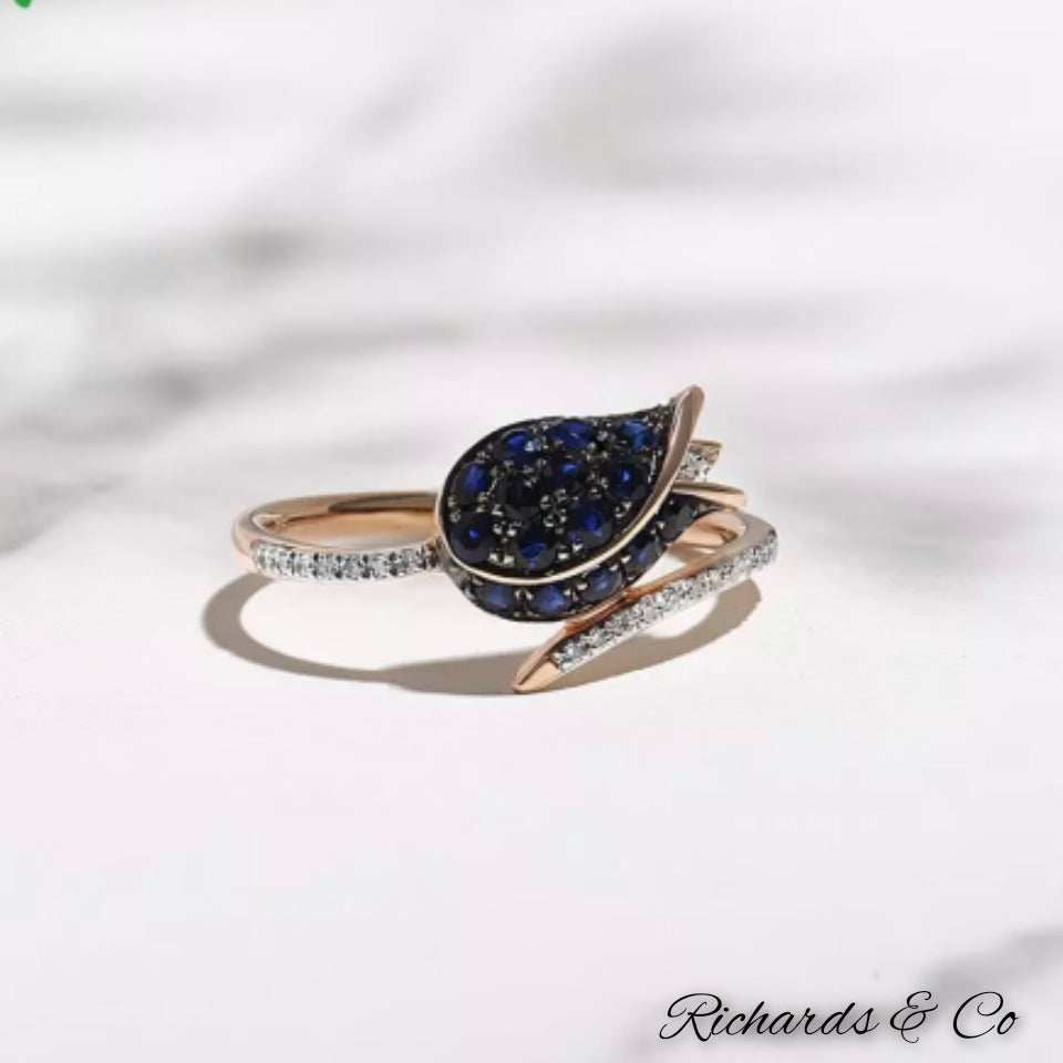 Earthy flower natural diamond and sapphire ring in 14k rose gold with pave setting and round blue sapphires
