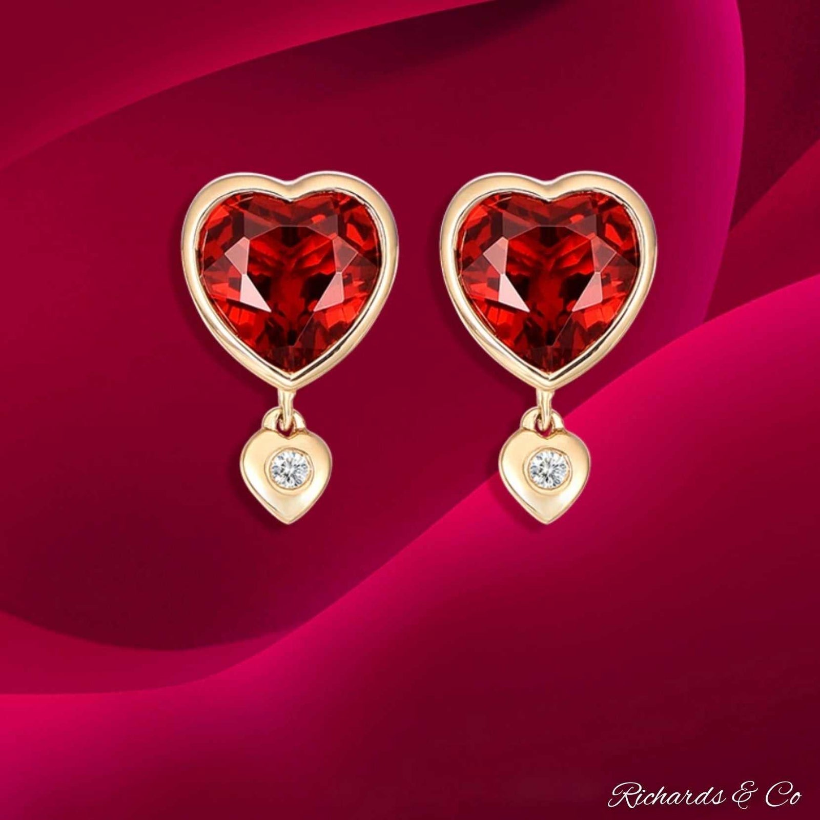 Heart-shaped garnet and diamond stud earrings in 18K multi-tone gold by Richards & Co
