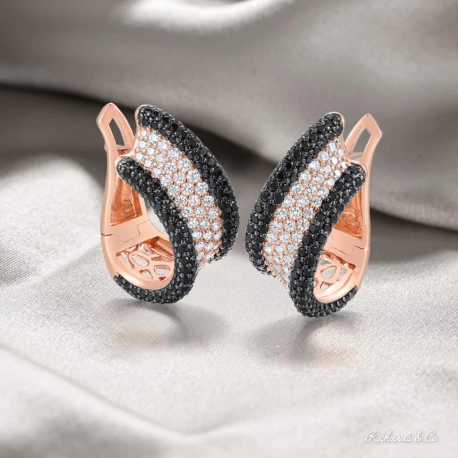 AURORA Earrings solid silver stud earrings with rose gold, white cubic zirconia, and black spinel stones, elegant curved design